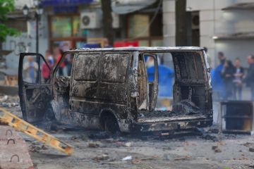 Burned car illustrating MA focusing on researching and reporting far-right extremism