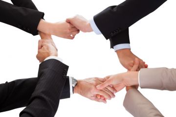 Intertwined handshakes symbolising overlap in interests and academic collaboration