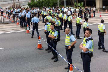 Protesters and Police officers outside the Hong Kong Queensway Pacific Place on October 13, 2014.