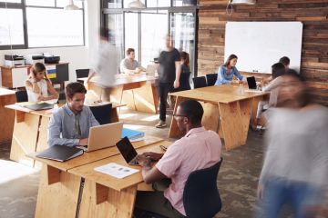 hot desks open plan office workers busy