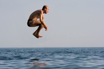 Man jumping into water