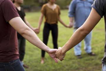 A group of people holding hands