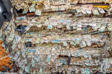 Key West, USA - January 25, 2021 Willie T's famous bar pub with many hanging US dollar bills banknotes on ceiling inside of restaurant