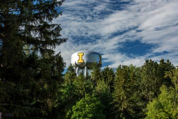 Arboretum filled with trees helps to frame university water tower in Idaho, USA