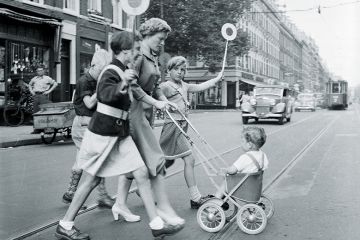 Mother and children crossing road