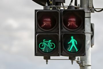 Pedestrian and cyclist traffic ‘Go’ signal representing approval of ARC grant funding