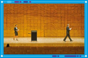 Man leaving stage whilst a woman walks towards lecturn. To illustrate  leadership churn in higher education