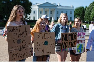 Young women with placards protesting