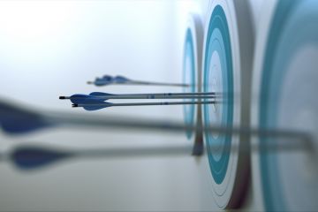 Arrows hitting a bullseye target