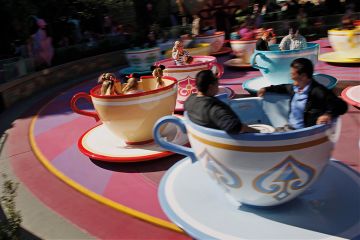 Guests ride the Tea Cups at Walt Disney Co.’s Disneyland Park in Anaheim, California