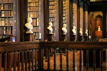 Thousands of books on shelves inside the Trinity College Library Dublin