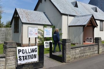 Trowbridge, UK - May 5, 2016 A voter visits a polling station at a church.
