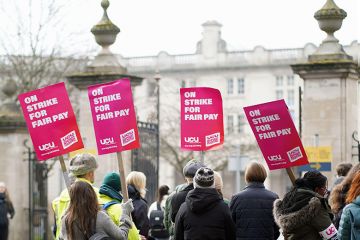 Academics and senior professional services staff hold a UCU strike rally in support of fair pay outside Cardiff University