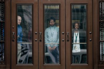 US civil servants watch anti-war protest from IRS building