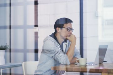 Asian man using laptop