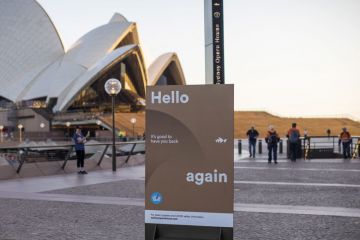 A sign welcomes people back outside the Sydney Opera House  in Sydney, Australia to illustrate ‘Give people time’ to readjust from pandemic, says Jackson