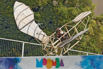 Contestant trying to fly his home made flying contraption taking part in the Birdman Rally in Melbourne, Australia to illustrate Faux ‘demand-driven’ equity approach won’t work, Canberra warned