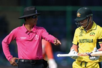 Australia's David Warner (R) asks the umpire to change his bat during the 2023 ICC Men's Cricket World Cup one-day international (ODI) match to illustrate Vice-chancellor pay guidelines ‘will help improve optics’