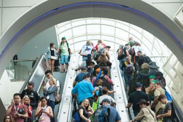  Crowds on escalator at the convention center in San Diego, California.