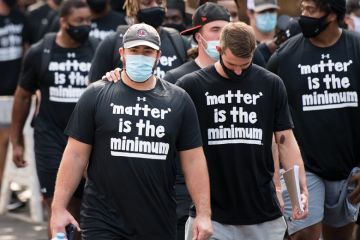  teammates and other student athletes on campus during a demonstration against racial inequality