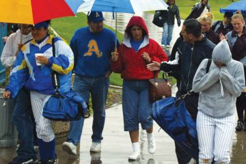 Spectators exit the Woodbridge Softball Classic Tournament which was postponed.