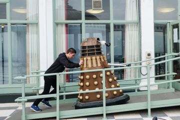 A man pushes a Dalek up a ramp in  Scarborough to illustrate UK research ‘smashed’ by US and China in key areas