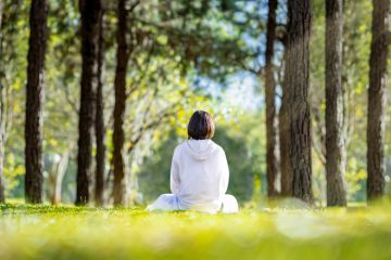 Woman relaxingly practicing meditation