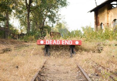 Railway buffers in India, reading "dead end"