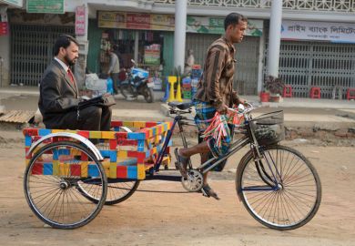 Businessman being transported on rickshaw