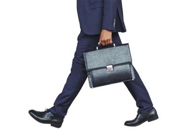 Businessman walking with briefcase