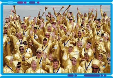 Crowd of people wearing gold suits, to illustrate the success at Johns Hopkins University in winning research grants