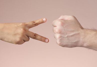 A fist and hands making a scissor shape, symbolising resisting cuts 