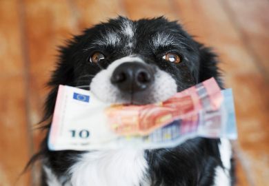 A dog offers banknotes, symbolising payment for peer review