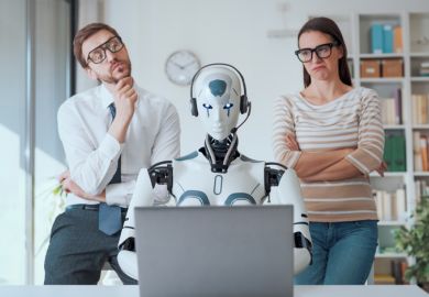 Humans look over the shoulder of a robot at a computer, symbolising human independent thought