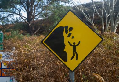 Yellow falling rocks sign