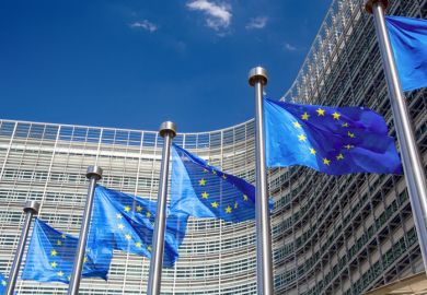 EU flags in front of the headquarters of the European Commission in Brussels, Belgium