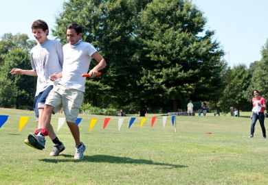 Two boys in a three-legged race