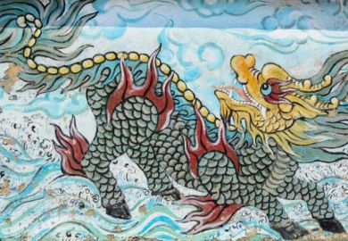 The colorful of old painting dragon on the wall of Chinese temple in Saigon, Vietnam.