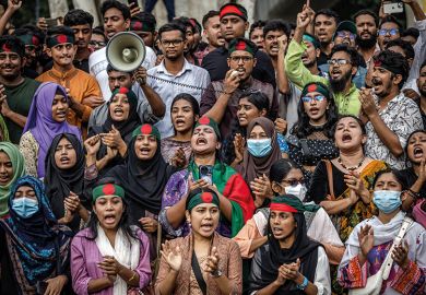 Students chant slogans as they protest to demand accountability and trial against Bangladesh's ousted Prime Minister Sheikh Hasina, near Dhaka University in the capital on August 12, 2024