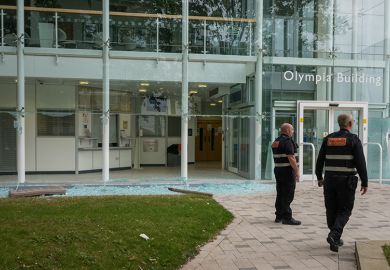 Buildings within Teesside University have their windows smashed as far-right activists hold a demonstration in Middlesbrough on August 04, 2024