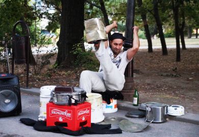 Varna, Bulgaria - September, 06, 2020 street drummer playing in the park with improvised means