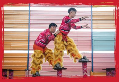 Lion dance performers seen during a closed rehearsal climbing up steps  in Kuala Lumpur, Malaysia to illustrate A bridge to all areas