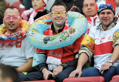 Polish fans wear aquatic equipment before the World Cup qualifying football match to illustrate Experts sceptical about Polish research assessment proposals