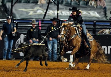 Person competes in the breakaway roping event during The American Rodeo, Texas to illustrate How Walmart founders’ donation bankrolled US private school push