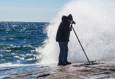 Waves crashing on rocks, over the photographer at Lake Superior Provincial Park, Ontario, Canada to illustrate Concerns over lack of oversight for privately funded research