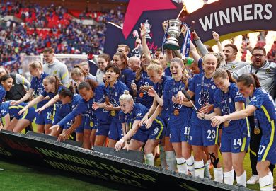 Chelsea celebrate on the podium as the boarding falls down during the Vitality Women's FA Cup Final match to illustrate ‘Complacent’ universities stuck on bottom rung of Athena Swan