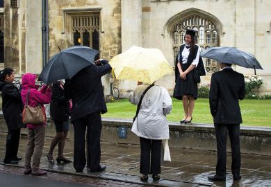 Students and their family and frinds queue outside the Senate house in Cambridge for Degree ceremonies to illustrate Leading universities urged to rethink growing graduation costs