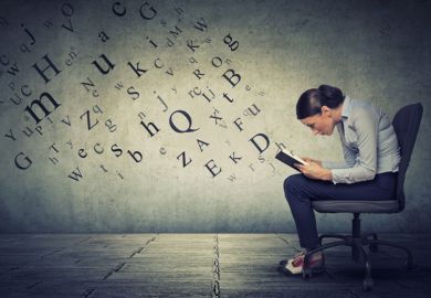 Woman reading with letters emerging from the book