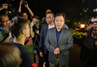 Students of University of Hong Kong surrounding Vice-Chancellor Xiang Zhang