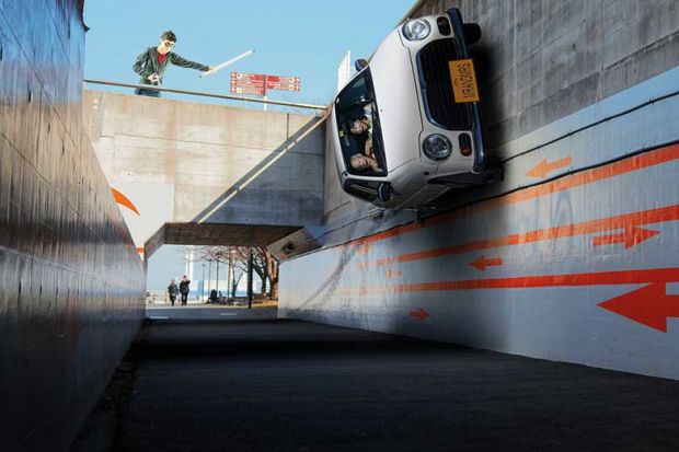 Car drives up wall online